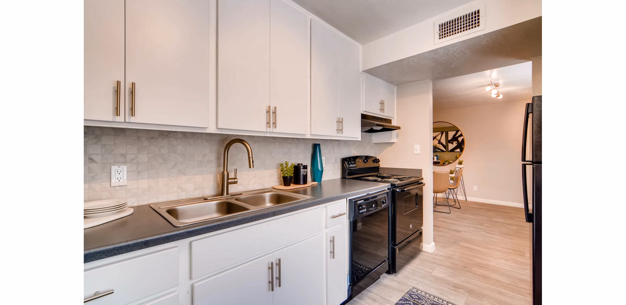 Modern kitchen with stainless steel appliances at The Glen at Old Town Apartments