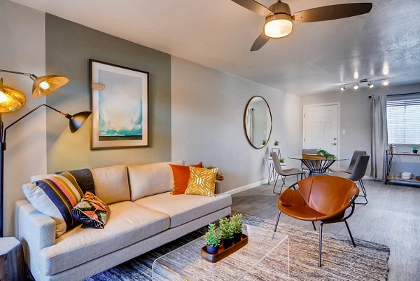 Spacious living room with modern furnishings at The Glen at Old Town Apartments, luxury property by Greystar