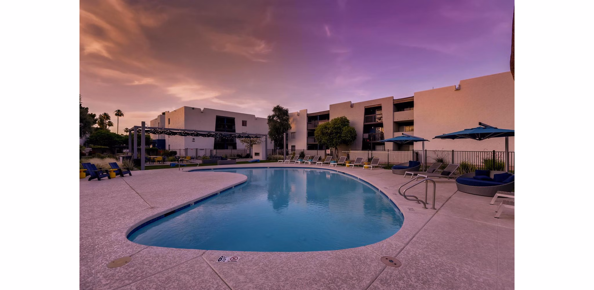 Infinity-edge pool with resort-style seating at The Glen at Old Town Apartments