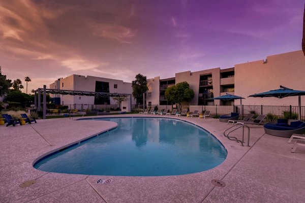 Infinity-edge pool with resort-style seating at The Glen at Old Town Apartments