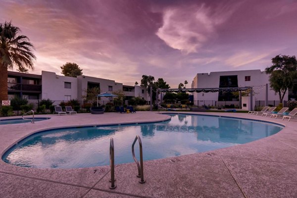 Modern swimming pool surrounded by lush gardens at The Glen at Old Town Apartments, offering luxury relaxation spaces