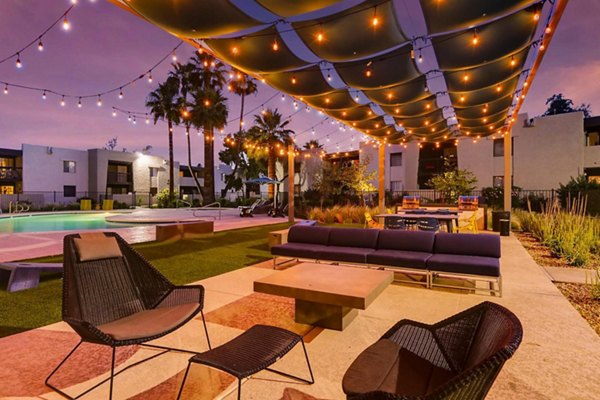 The Glen at Old Town Apartments: Lush courtyard with gardens and seating areas, offering a serene retreat in a luxury apartment community