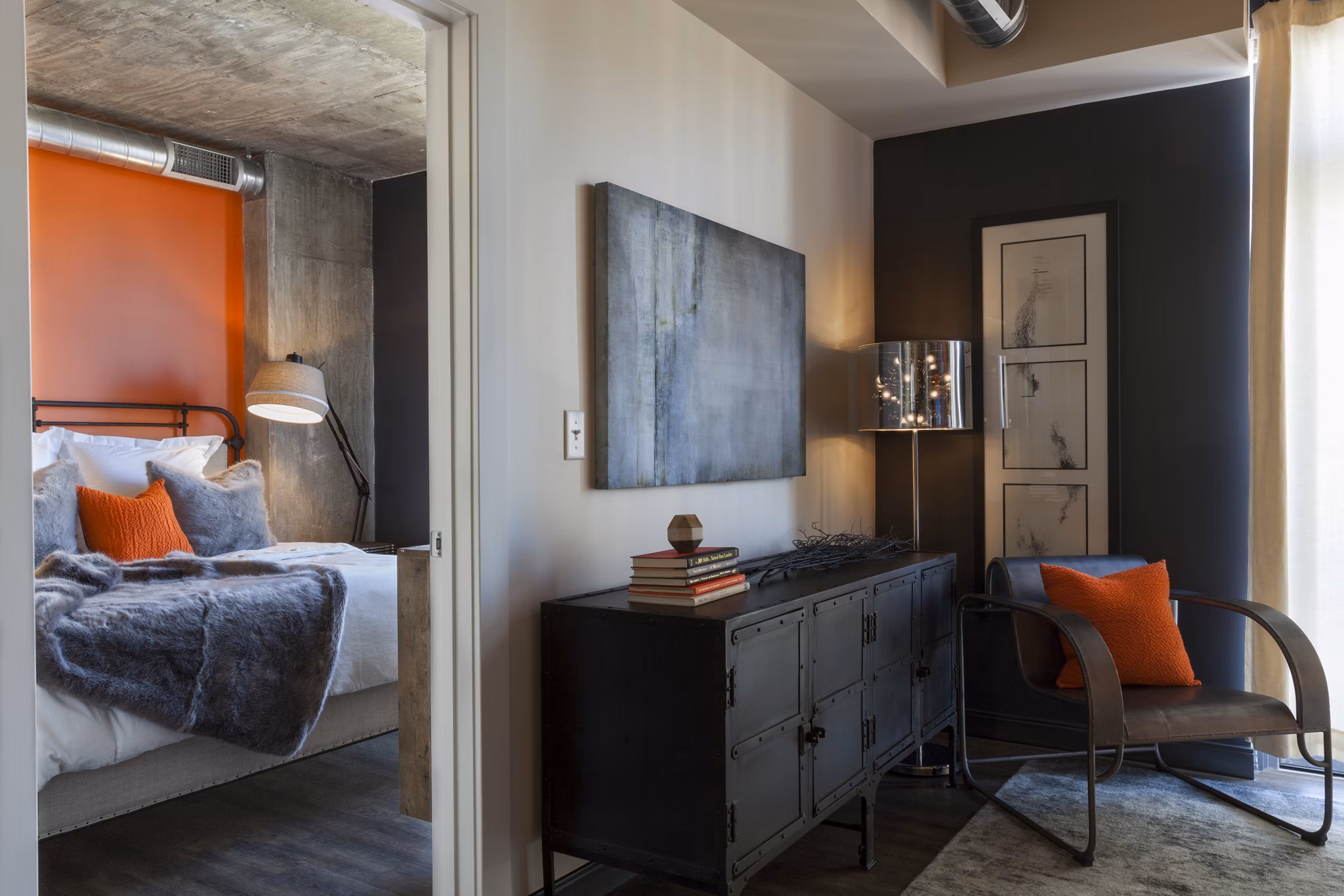 Cozy bedroom with large windows at Anthology Apartments, offering a tranquil living space in luxury Greystar apartments