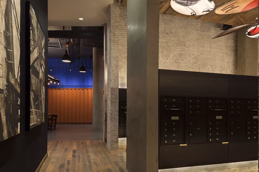 Mail room with organized parcel lockers at Anthology Apartments