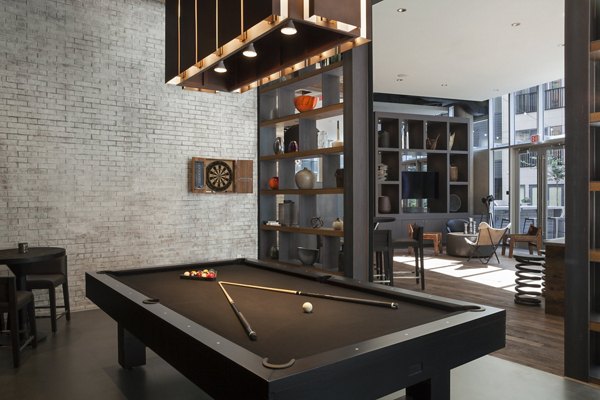 Clubhouse with stylish seating and modern decor at Anthology Apartments, luxury property by Greystar