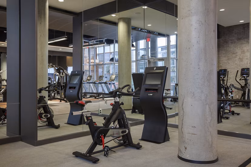 State-of-the-art fitness center at Anthology Apartments with cardio and weight training equipment