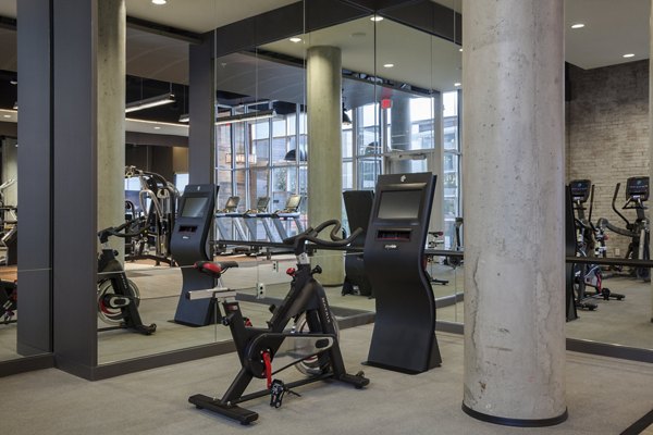 State-of-the-art fitness center at Anthology Apartments with cardio and weight training equipment