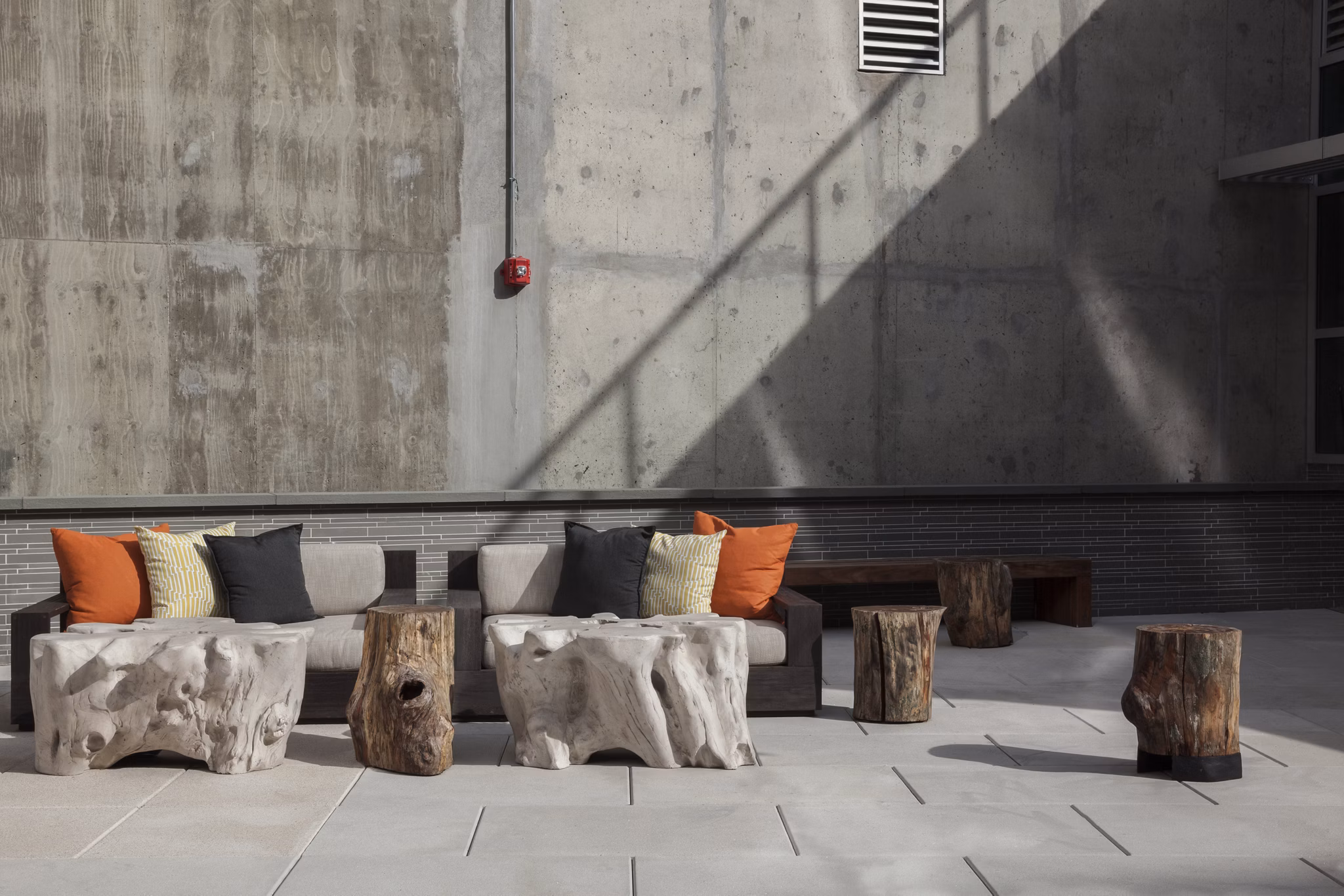 Anthology Apartments: Modern patio area with stylish seating arrangements in a luxury community