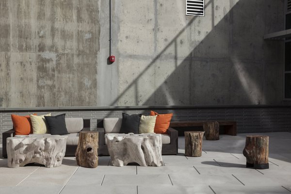 Anthology Apartments: Modern patio area with stylish seating arrangements in a luxury community