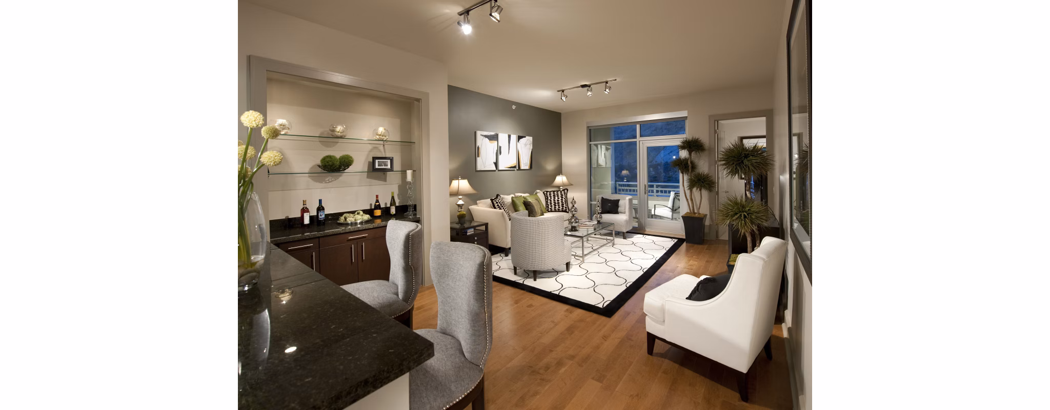Elegant living room with chic furnishings and large windows in Ashton San Francisco Apartments