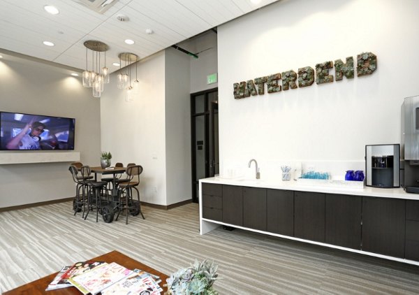 Clubhouse with modern decor at Waterbend Apartments: Luxury community spaces designed for relaxation and socializing