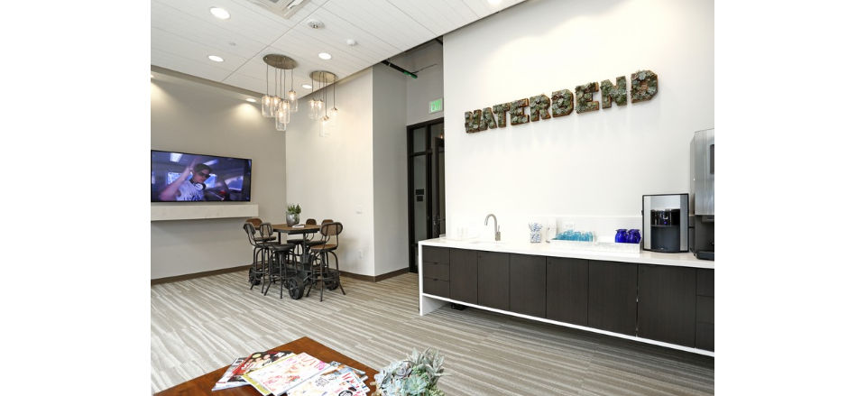 Clubhouse with modern decor at Waterbend Apartments: Luxury community spaces designed for relaxation and socializing