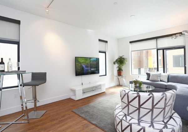 Spacious living room with elegant furnishings at Waterbend Apartments in luxury Greystar community