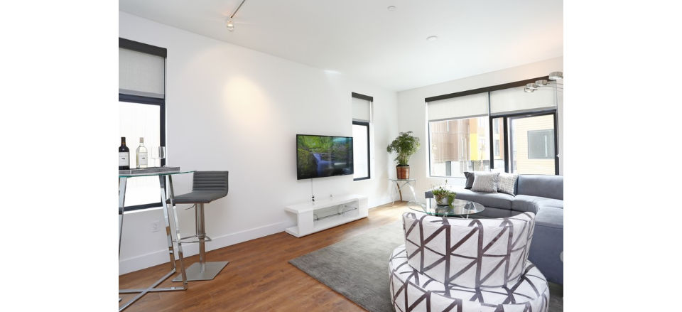 Spacious living room with elegant furnishings at Waterbend Apartments in luxury Greystar community