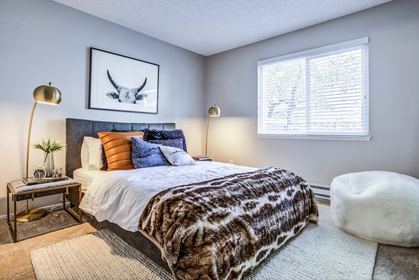Cozy bedroom with modern furnishings at Avana Almaden Apartments, a luxury Greystar property in San Jose