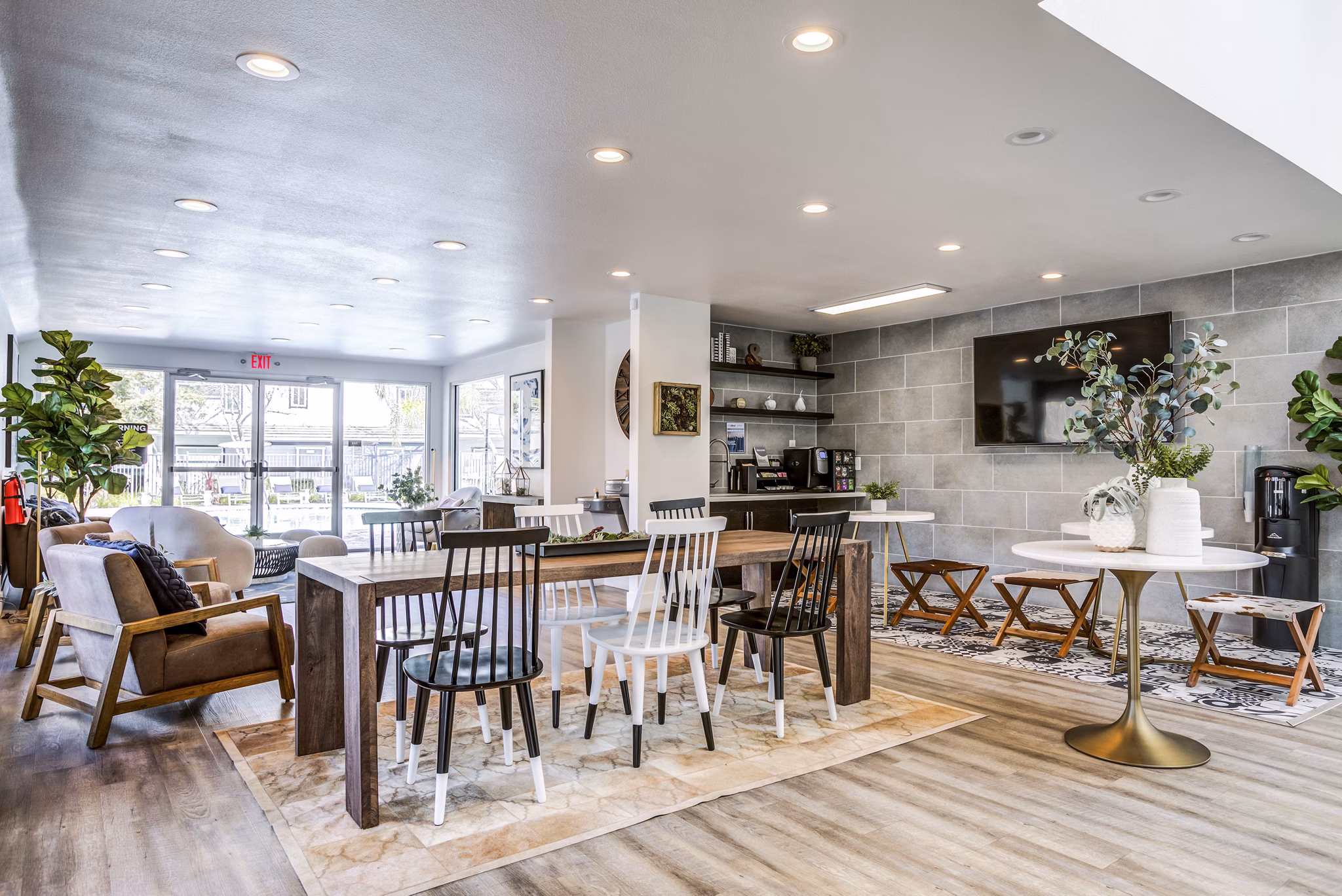 Clubhouse lobby with modern decor at Avana Almaden Apartments, featuring elegant seating and ambient lighting