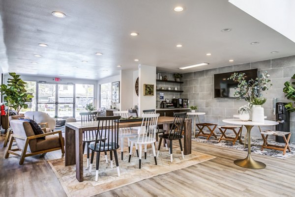 Clubhouse lobby with modern decor at Avana Almaden Apartments, featuring elegant seating and ambient lighting