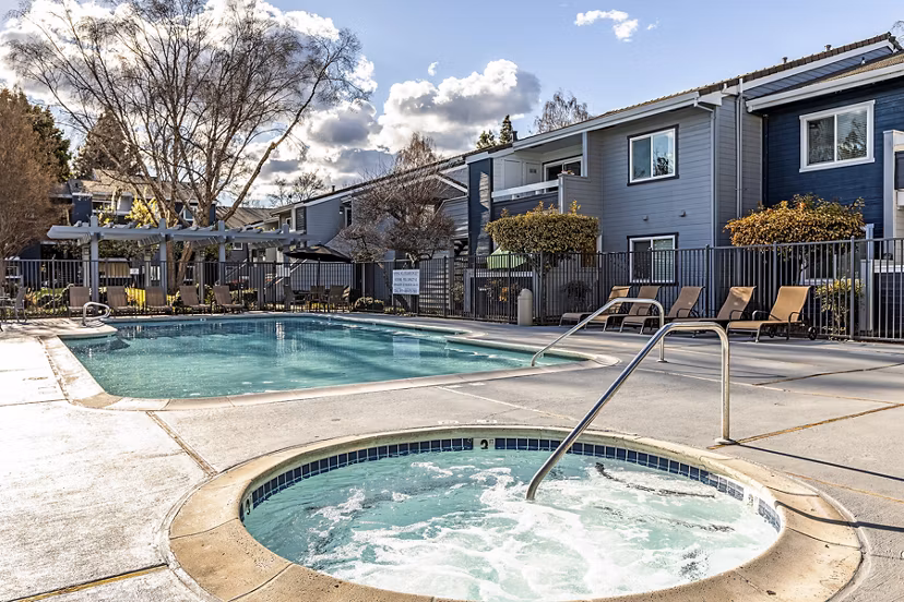 Relaxing hot tub area at Avana Almaden Apartments with ambient lighting and modern design, ideal for unwinding after a long day