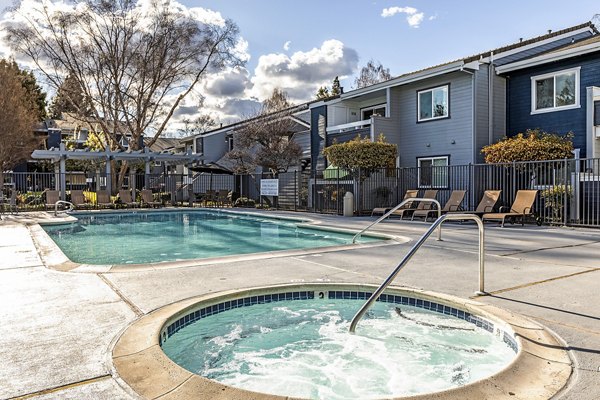 Relaxing hot tub area at Avana Almaden Apartments with ambient lighting and modern design, ideal for unwinding after a long day