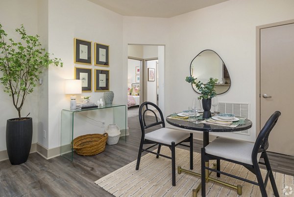 Dining area with modern furnishings at Pencil Factory Flats Apartments