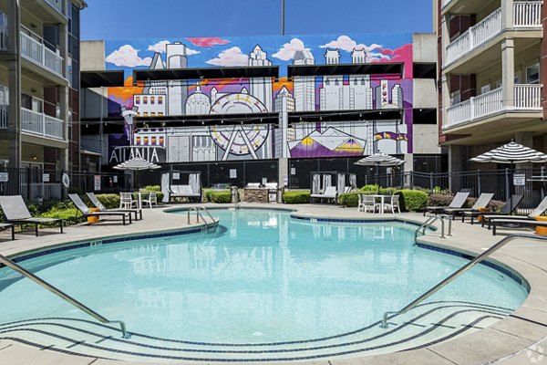 Rooftop pool with city skyline views at Pencil Factory Flats Apartments