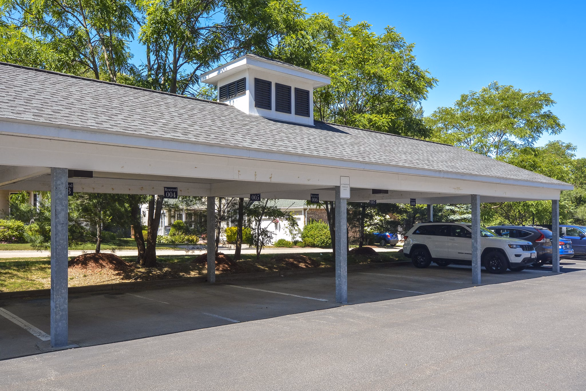 Secure resident parking garage at Lux at Stoughton Apartments with ample space and lighting