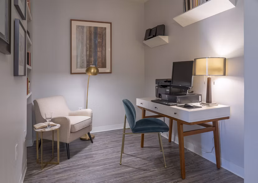 Spacious kitchen with modern stainless steel appliances in Lux at Stoughton Apartments