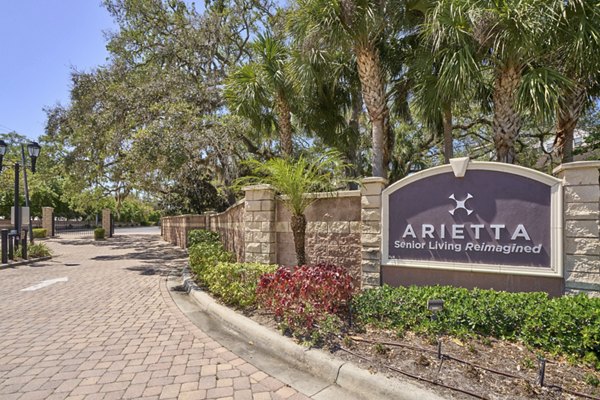 Arietta Apartments: Modern signage at luxury property in downtown location