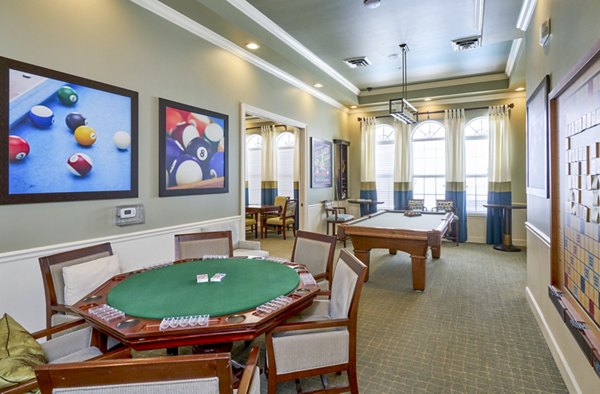 Modern clubhouse with stylish seating and entertainment options at Arietta Apartments