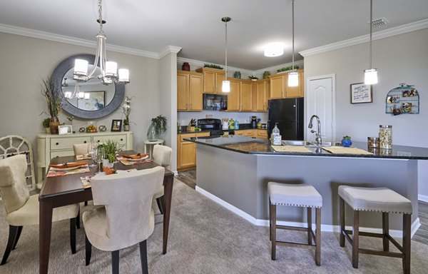 Dining room featuring elegant decor and modern lighting at Arietta Apartments