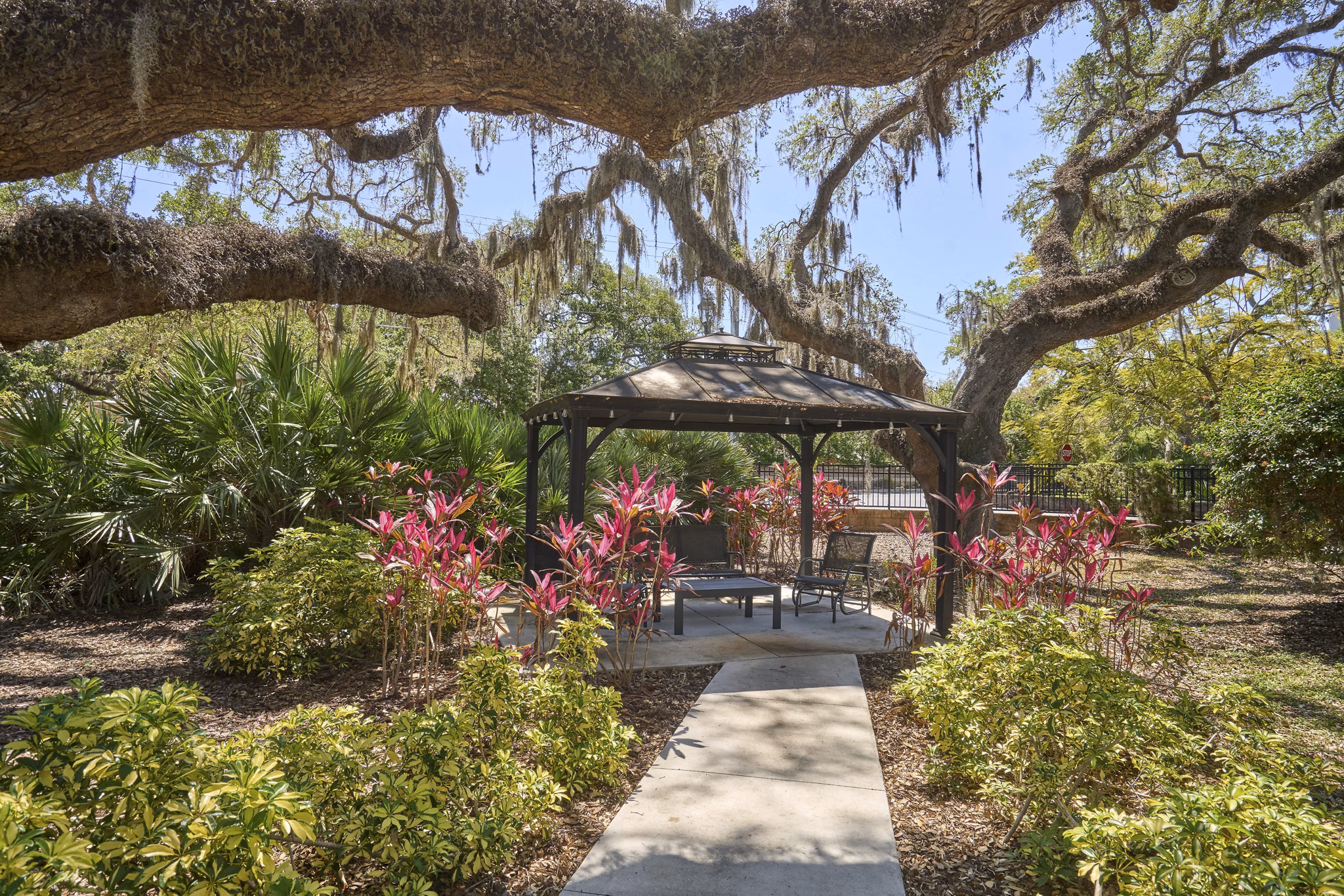 Spacious patio with elegant outdoor seating at Arietta Apartments, perfect for relaxation and entertainment