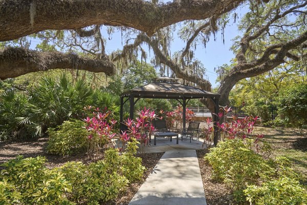 Spacious patio with elegant outdoor seating at Arietta Apartments, perfect for relaxation and entertainment