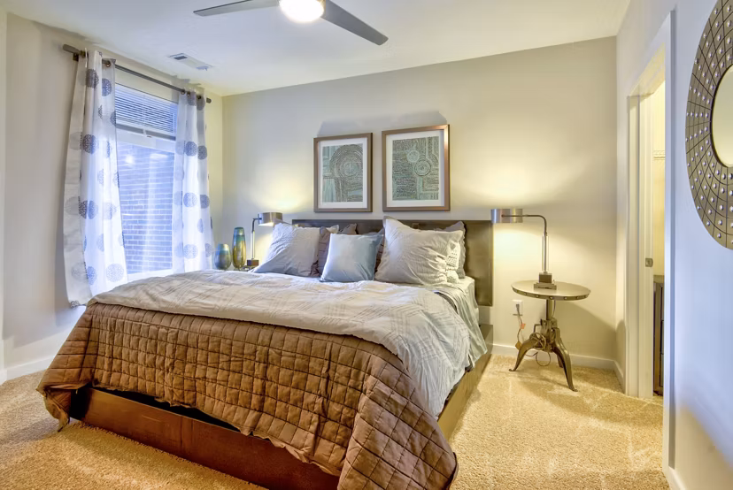 Bedroom with stylish decor at Liberty Warehouse Apartments