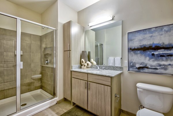 Modern bathroom with stylish fixtures at Liberty Warehouse Apartments in Raleigh, offering luxury living spaces