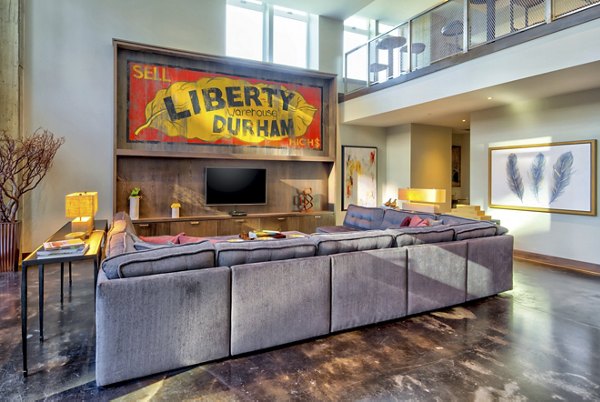Spacious clubhouse with modern decor at Liberty Warehouse Apartments, offering luxury living spaces in a vibrant community setting