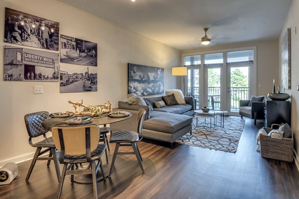 Spacious living room with modern decor at Liberty Warehouse Apartments