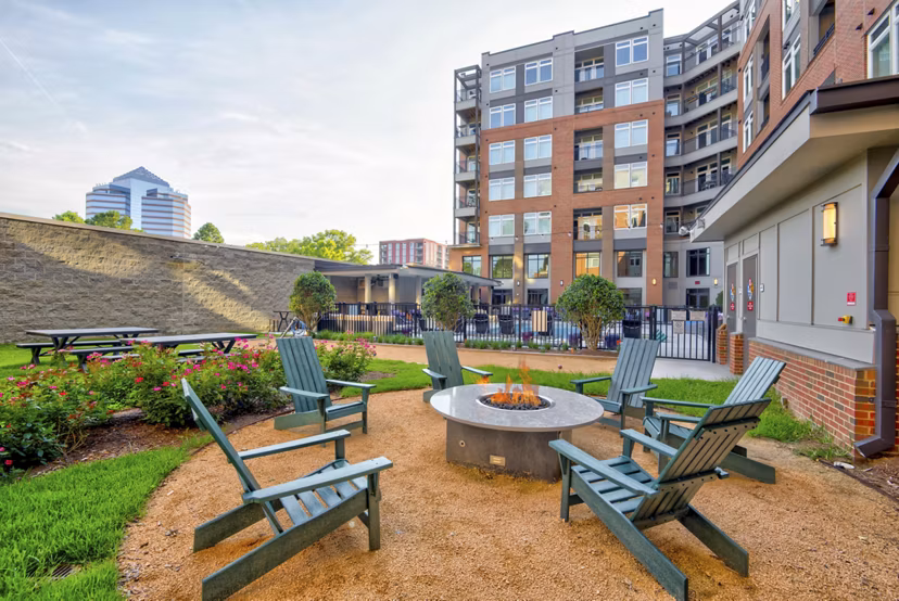 Cozy outdoor fire pit area at Liberty Warehouse Apartments, a luxurious community offering relaxation and social spaces