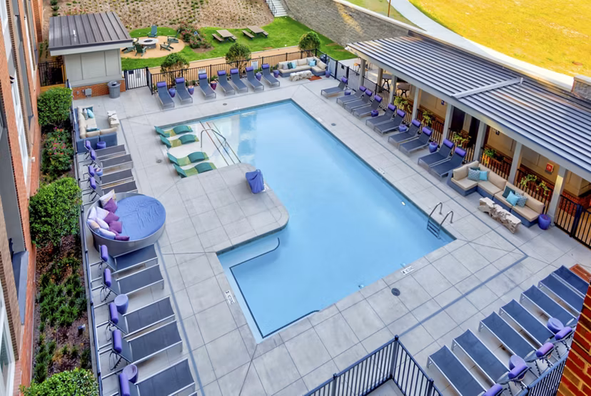 Rooftop pool with skyline views at Liberty Warehouse Apartments
