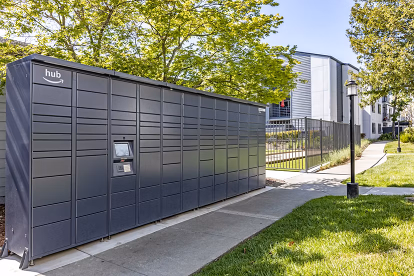 Modern mail room at Avana Stoneridge Apartments with secure package lockers and sleek design