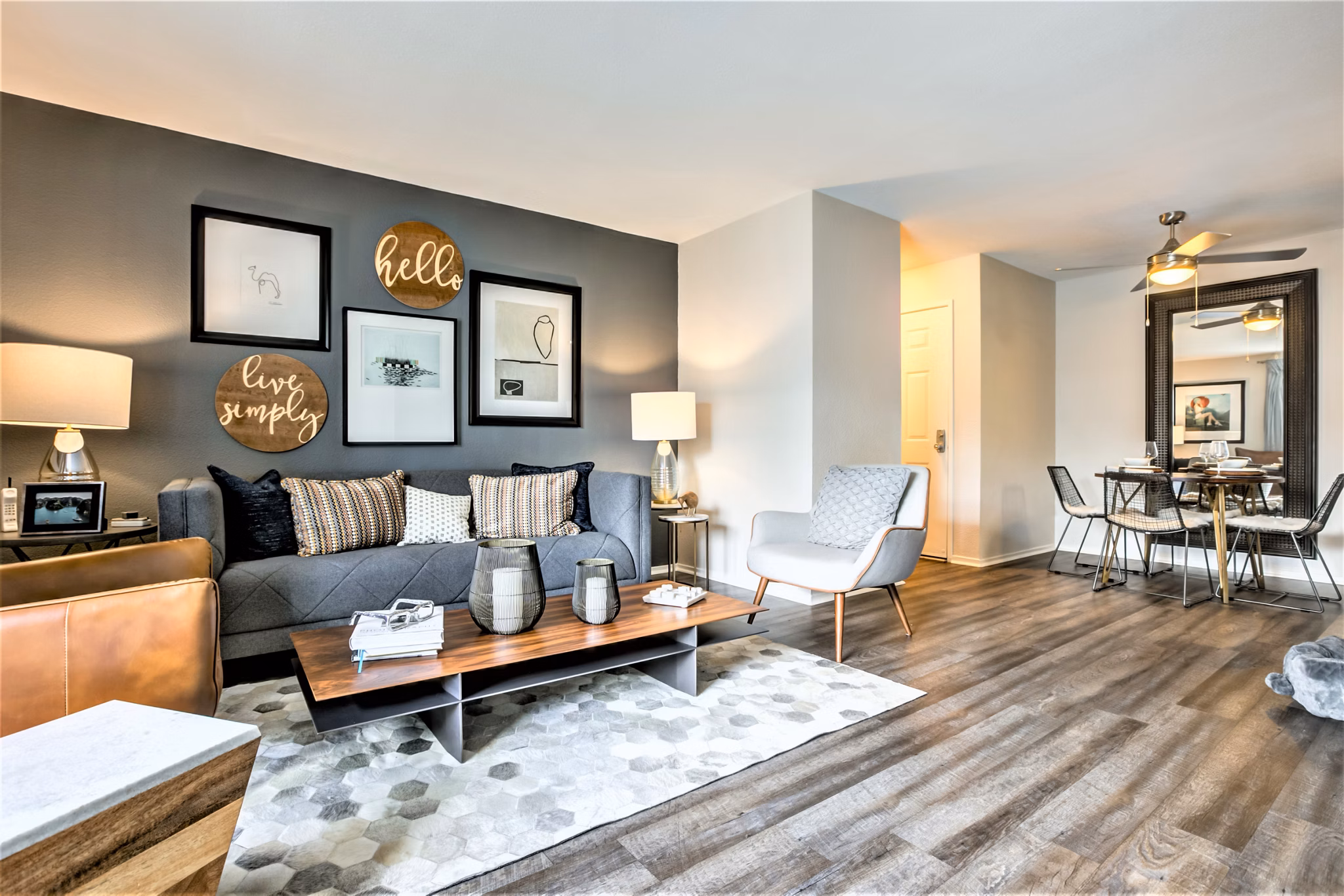 Spacious living room with modern furnishings and natural light at Avana Stoneridge Apartments
