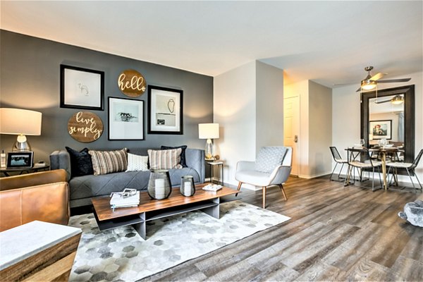 Spacious living room with modern furnishings and natural light at Avana Stoneridge Apartments