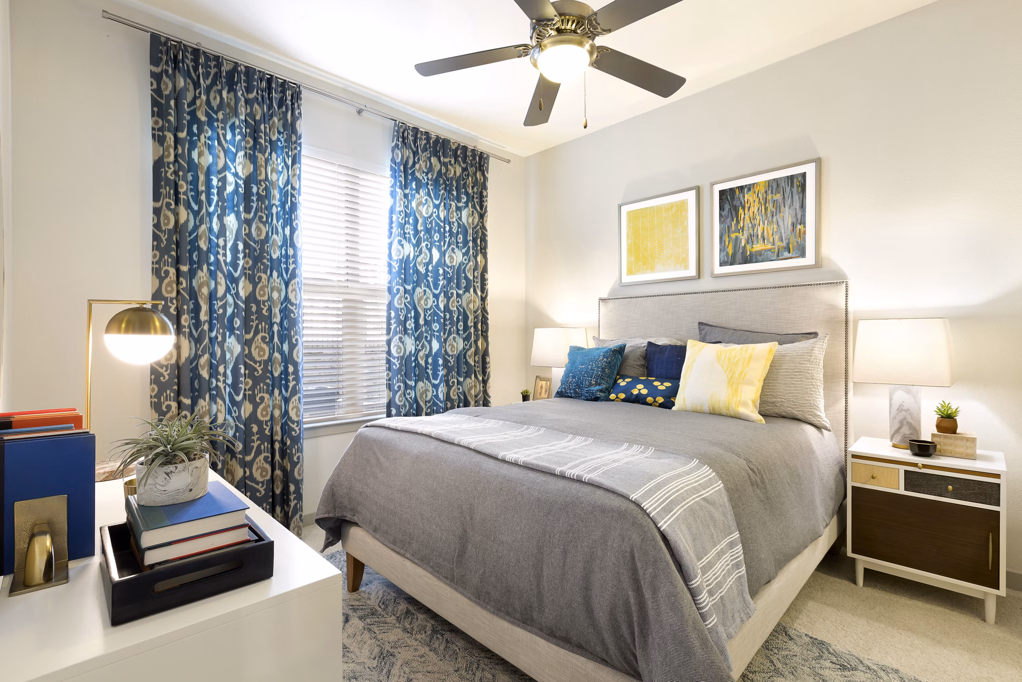 Bedroom showcasing elegant decor and plush bedding at Villas on the Hill Apartments Luxurious space designed for comfort and style