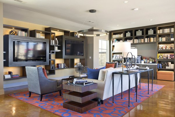 Clubhouse featuring modern seating and entertainment options at Villas on the Hill Apartments