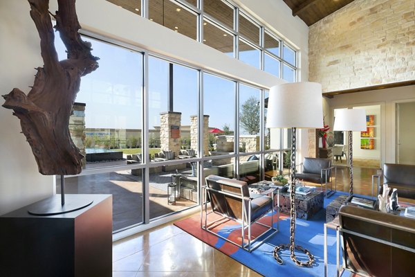 Clubhouse featuring modern lounge and entertainment area at Villas on the Hill Apartments