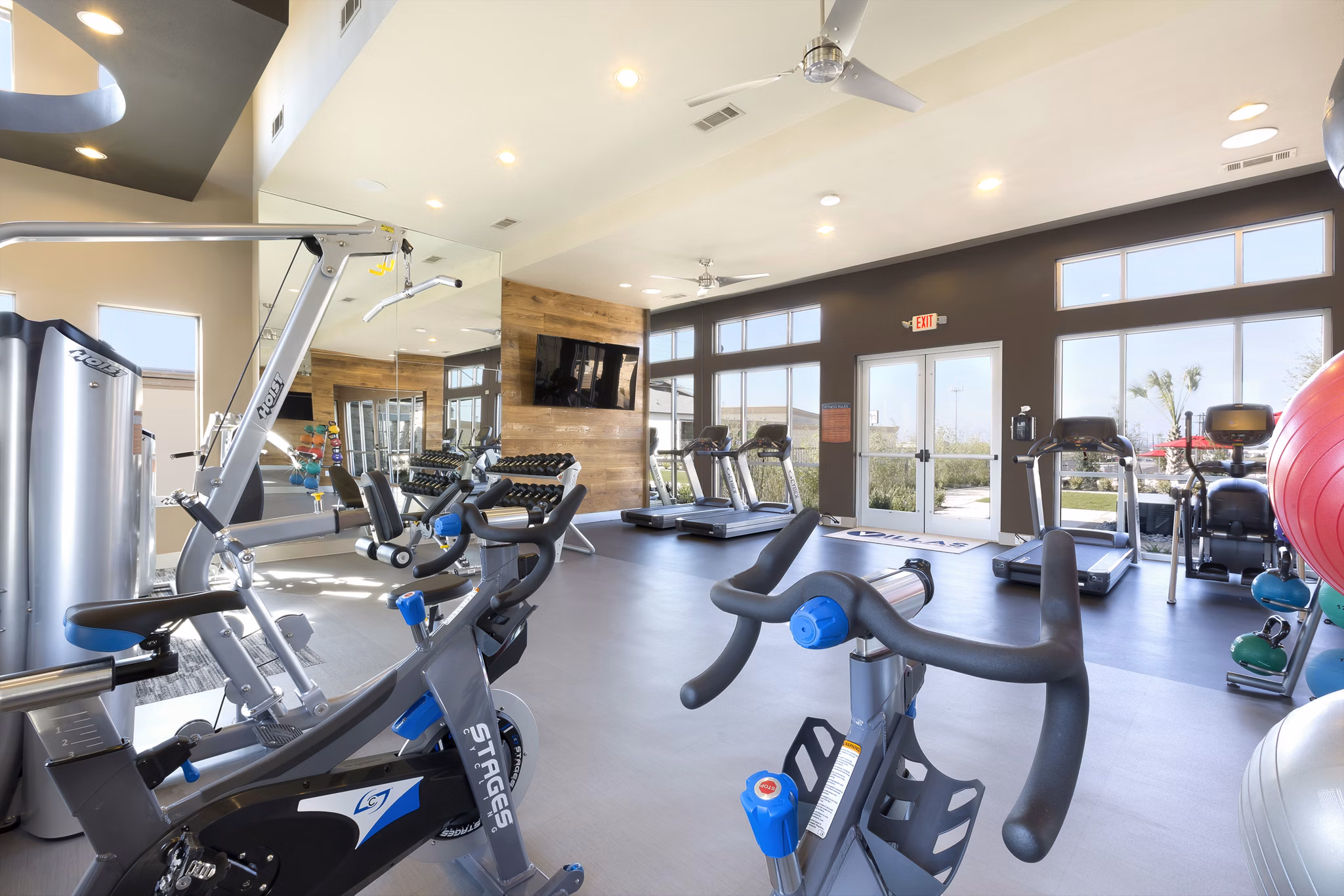 Modern fitness room with state-of-the-art equipment at Villas on the Hill Apartments