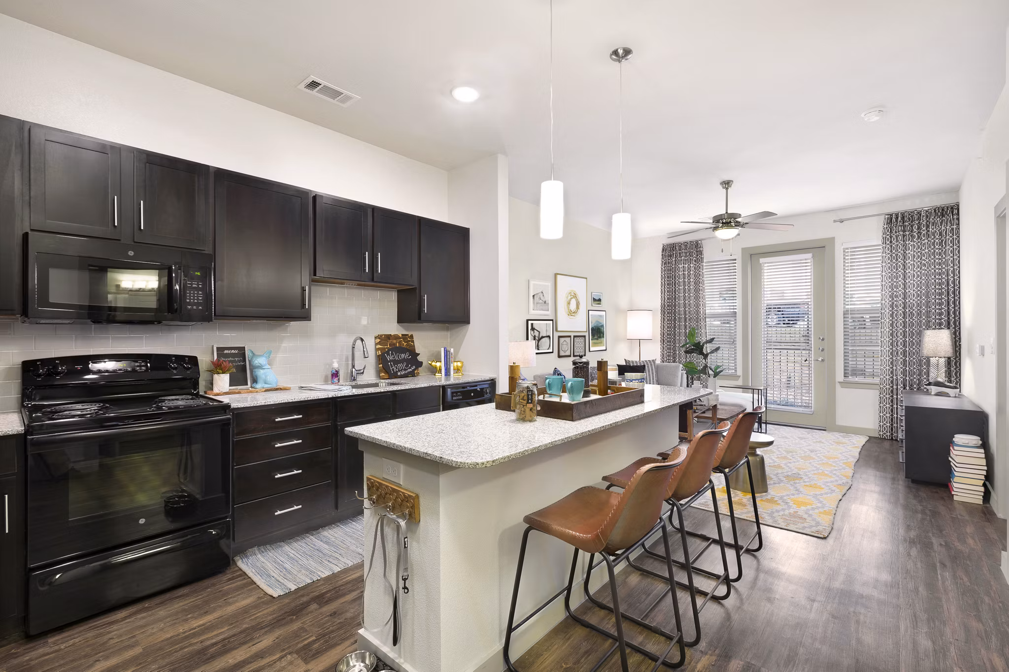 Modern kitchen with stainless steel appliances at Villas on the Hill Apartments