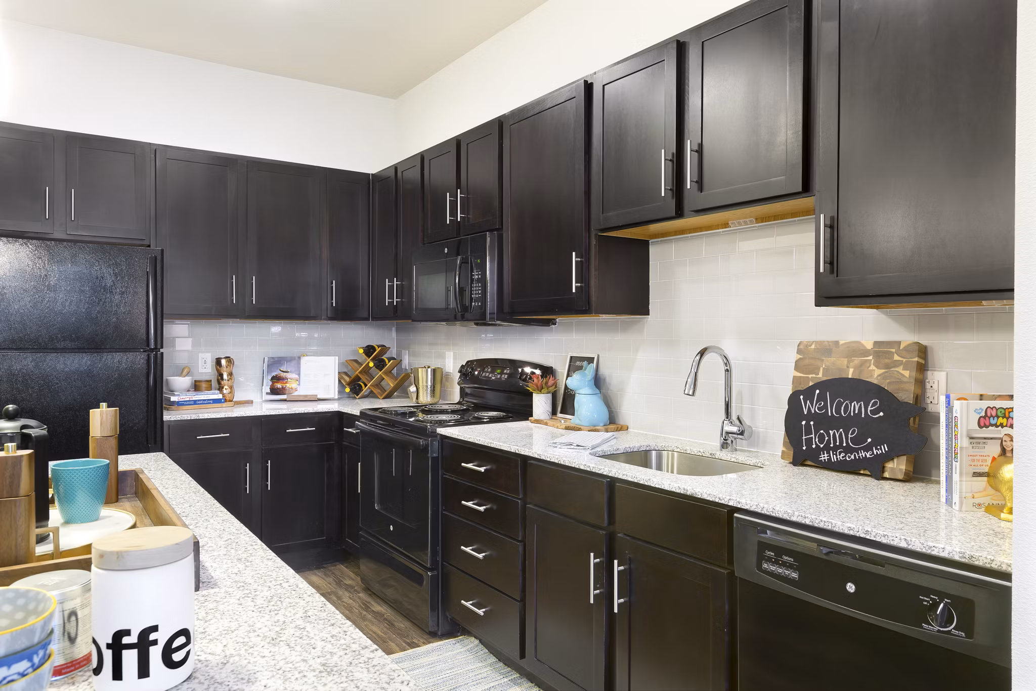 Modern kitchen with stainless steel appliances in Villas on the Hill Apartments