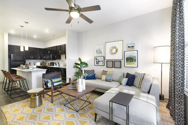 Spacious living room with modern decor at Villas on the Hill Apartments