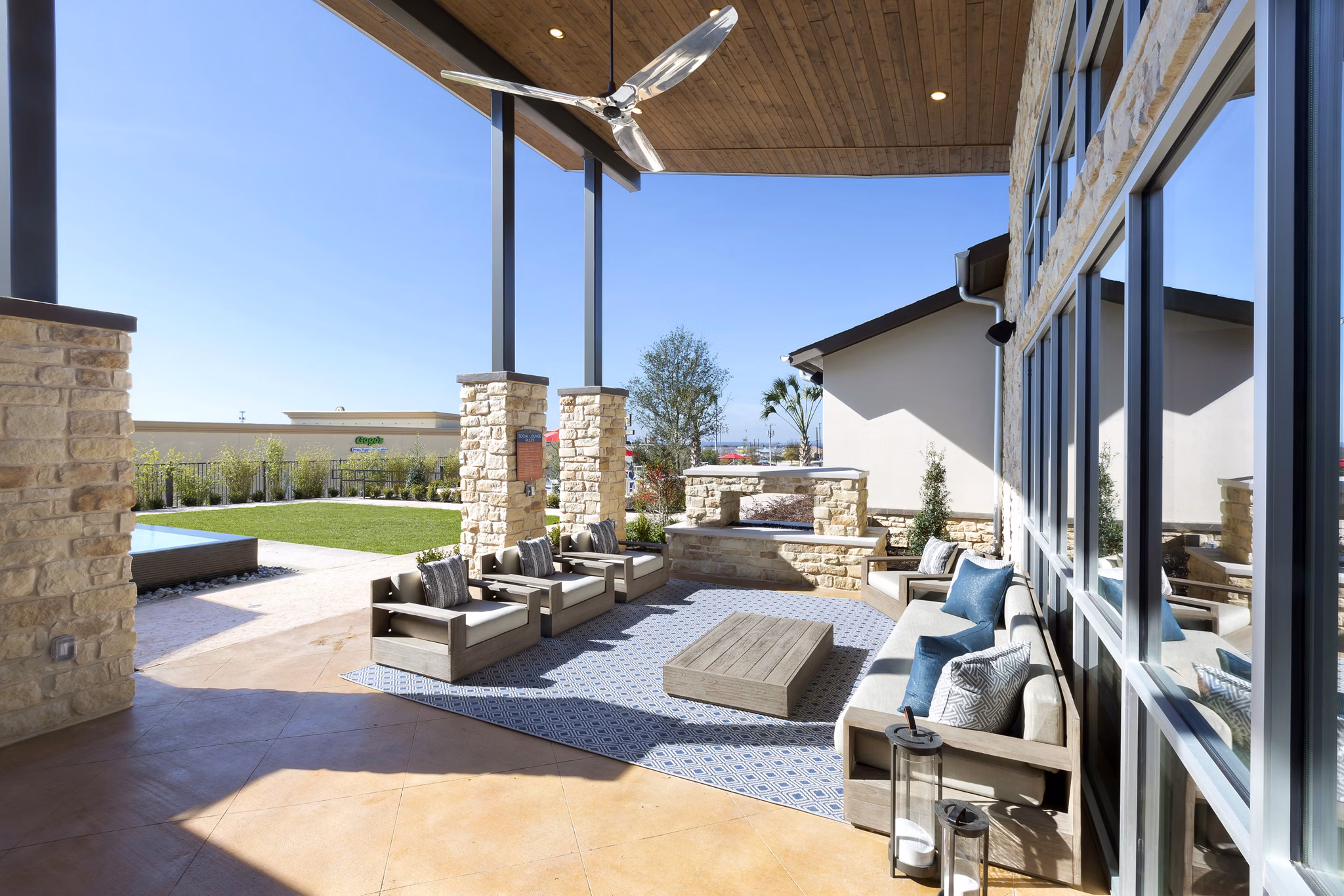 Relaxing patio space with comfortable seating at Villas on the Hill Apartments