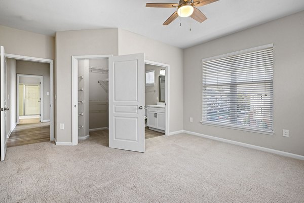 Spacious bedroom with modern design elements in Windsor at Tryon Village Apartments
